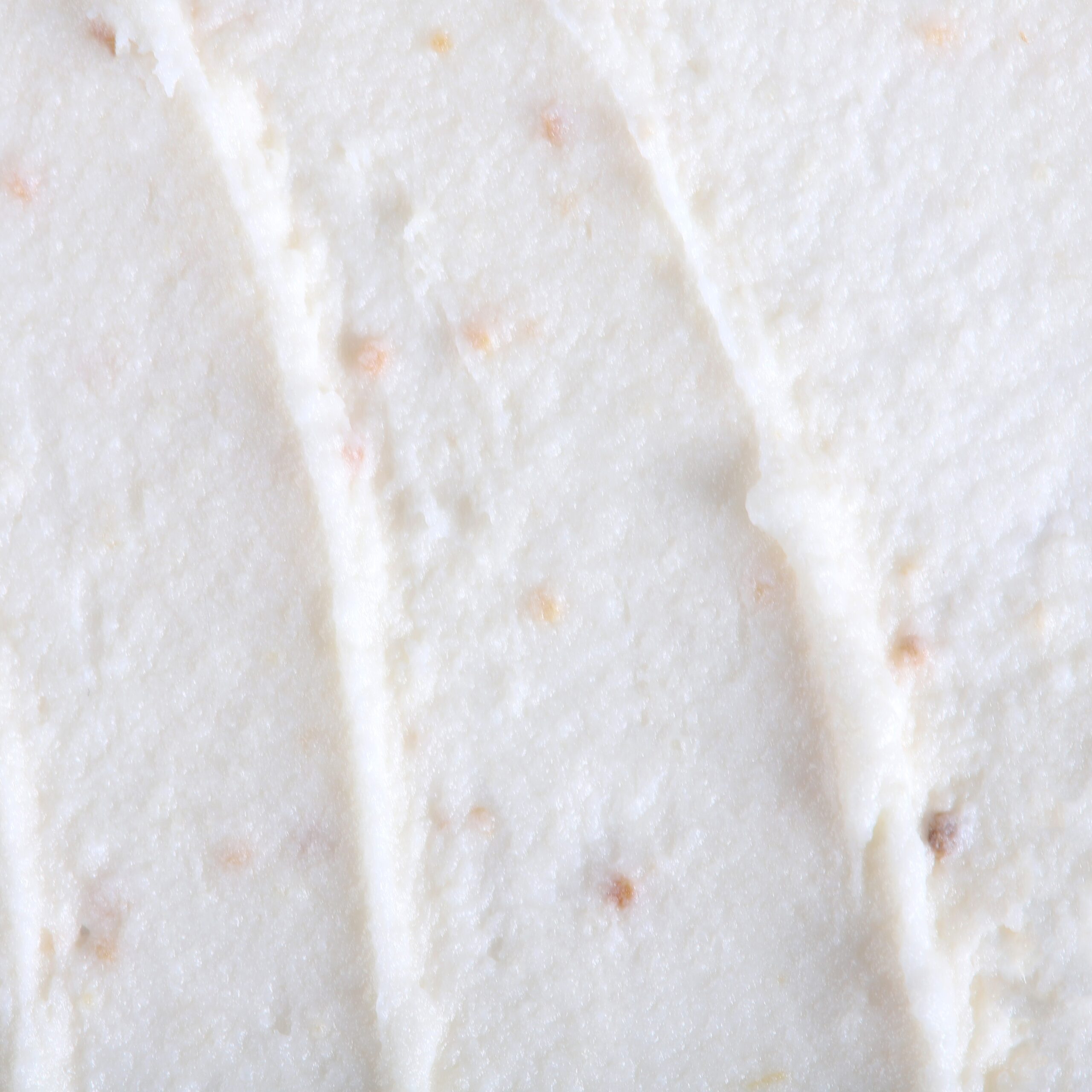 Face whipped cream scrub with ginger, offering gentle exfoliation and a smooth, airy mousse-like texture.