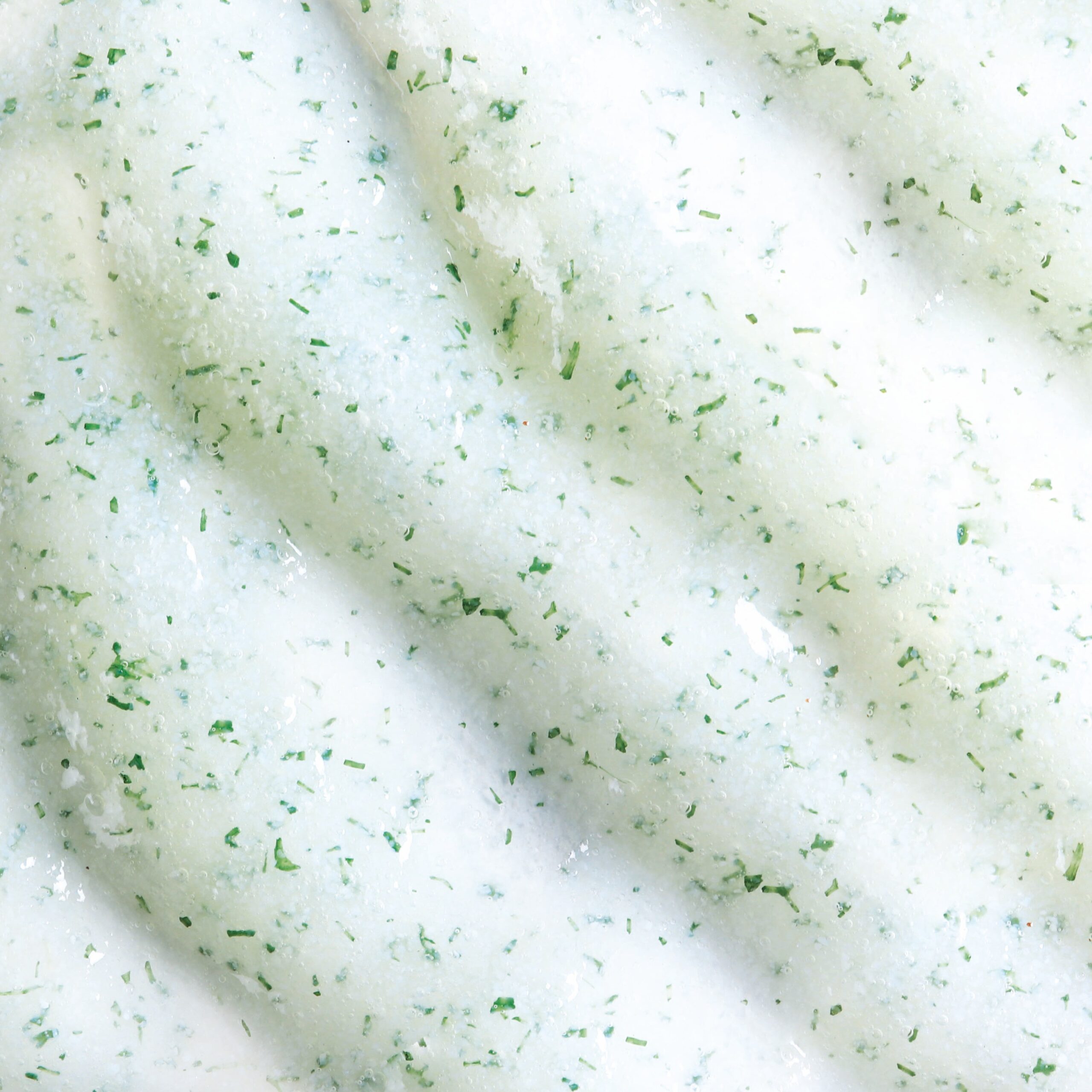 Face gel scrub with a mojito-inspired scent, offering gentle exfoliation and a refreshing texture.