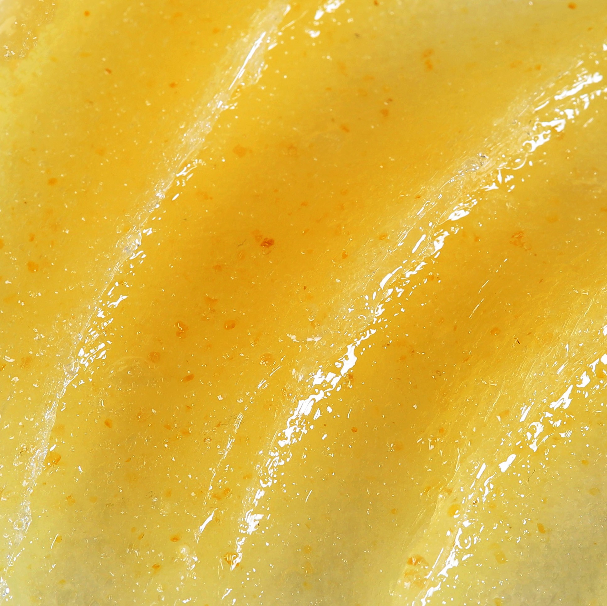 Face and lips honey, lemon & yuzu scrub, offering gentle exfoliation with a melting texture.